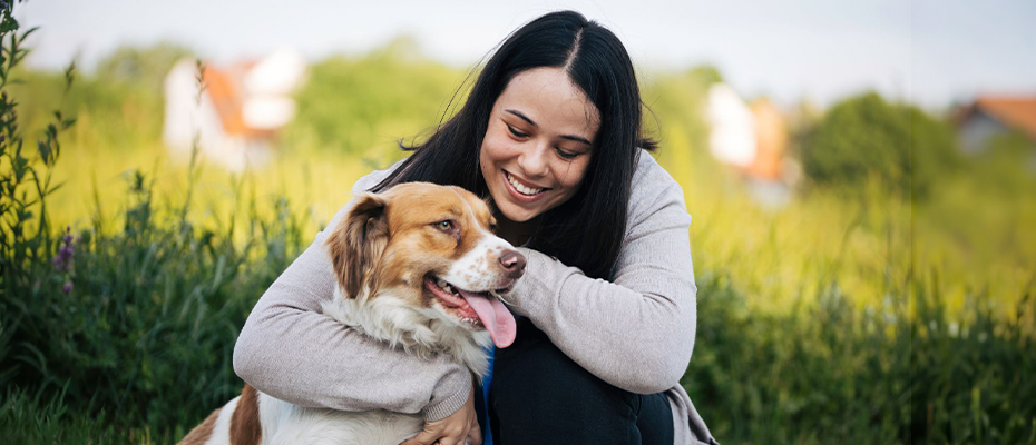 Woman and her dog in a field