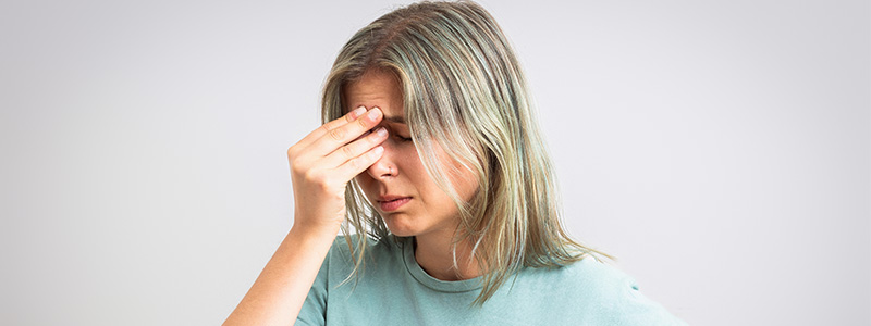 Woman holding her head
