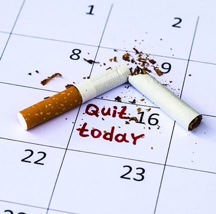 Crushed cigarette on a calendar