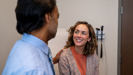 Dr. Dhople talking with patient