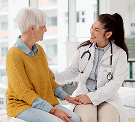 Woman sitting with her doctor