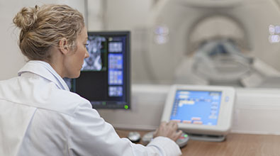 Doctor looking at xray machine