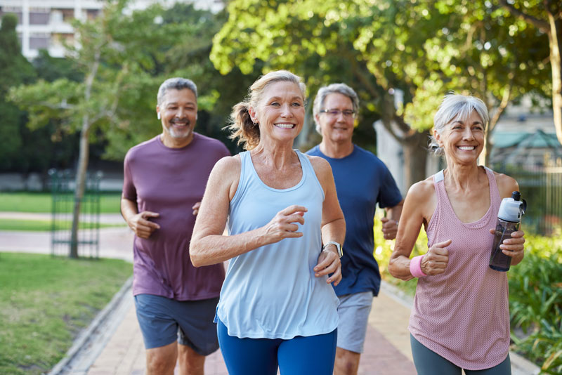 senior-healthy-group-jogging-together-at-park