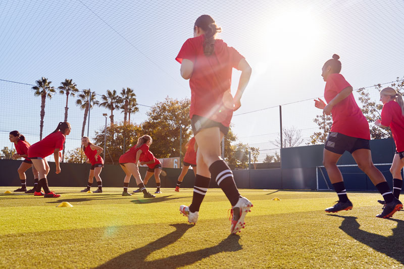 womens-football-team-run-whilst-training