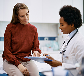 Doctor explaining something to her patient