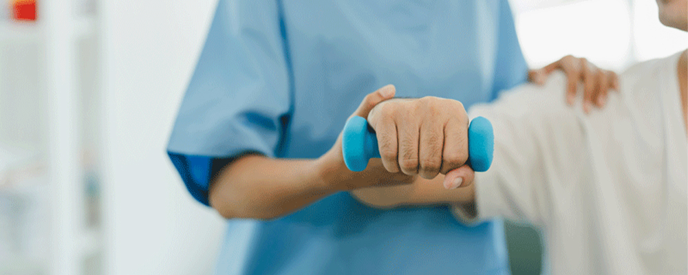 health-professional-assisting-adult-exercising